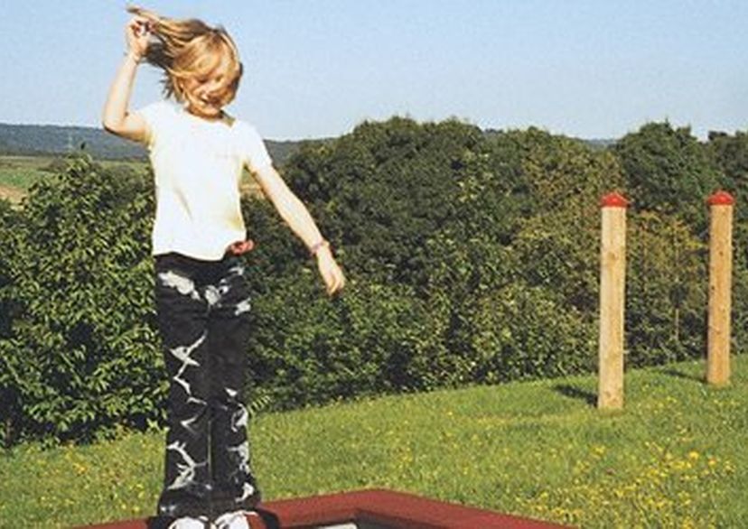 Buried frame for dig-in trampolines