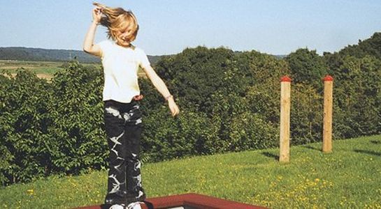 Buried frame for dig-in trampolines