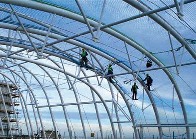 workers on a building site with safety nets