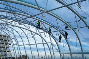 workers on a building site with safety nets