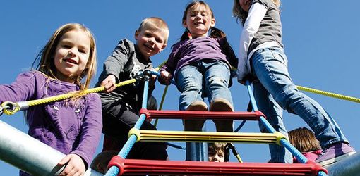 Early years playground equipment with child playing